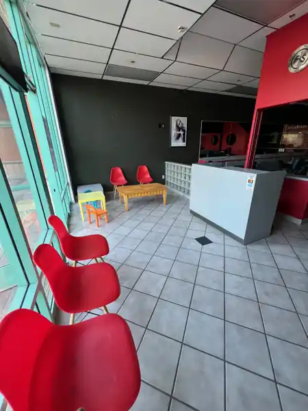 Waiting area with full-height storefront glass